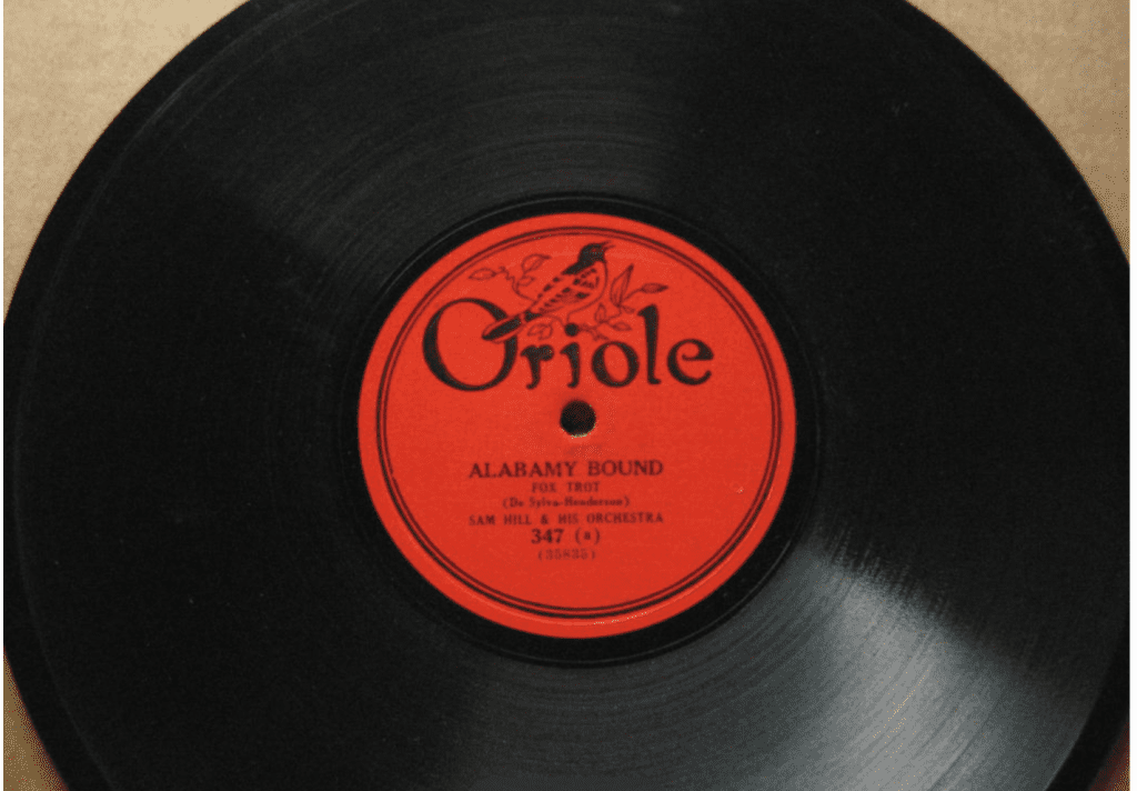 Oriole record label with oriole bird above record script. Orange in color. Alabamy bound in center of disc with Sam Hill and his orchestra as the band.