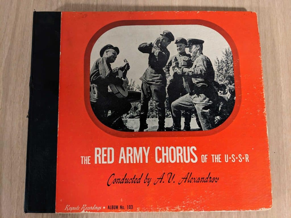 The Red Army Chorus of the USSR front cover. As an image embedded on it of soviet soliders singing and dancing. Red in color.