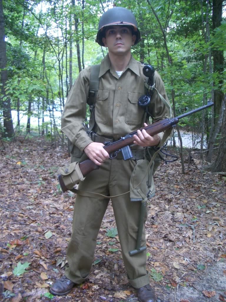 WW2 Reenactor holding m1 carbine with SCR-300 radio